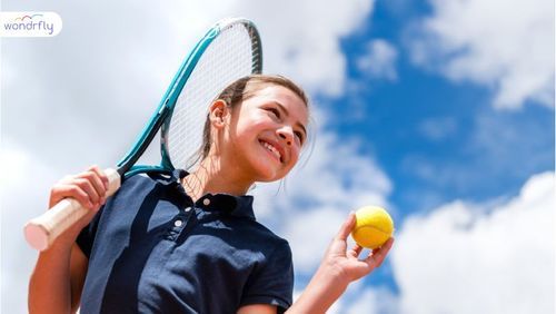 small_a_girl_holding_a_ball_and_badmintion_c880539af8.jpeg