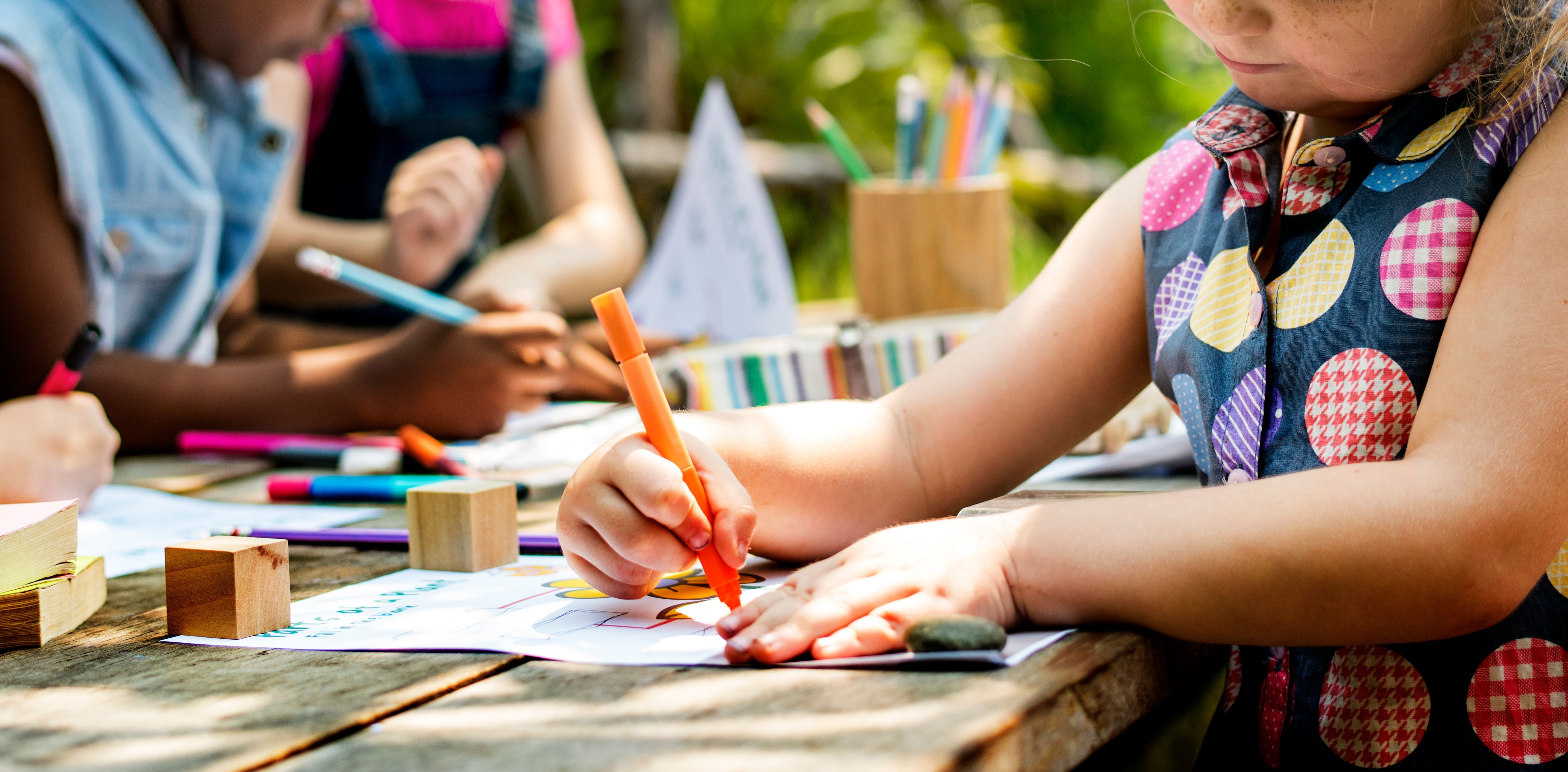 A kid is Sketching on Paper 