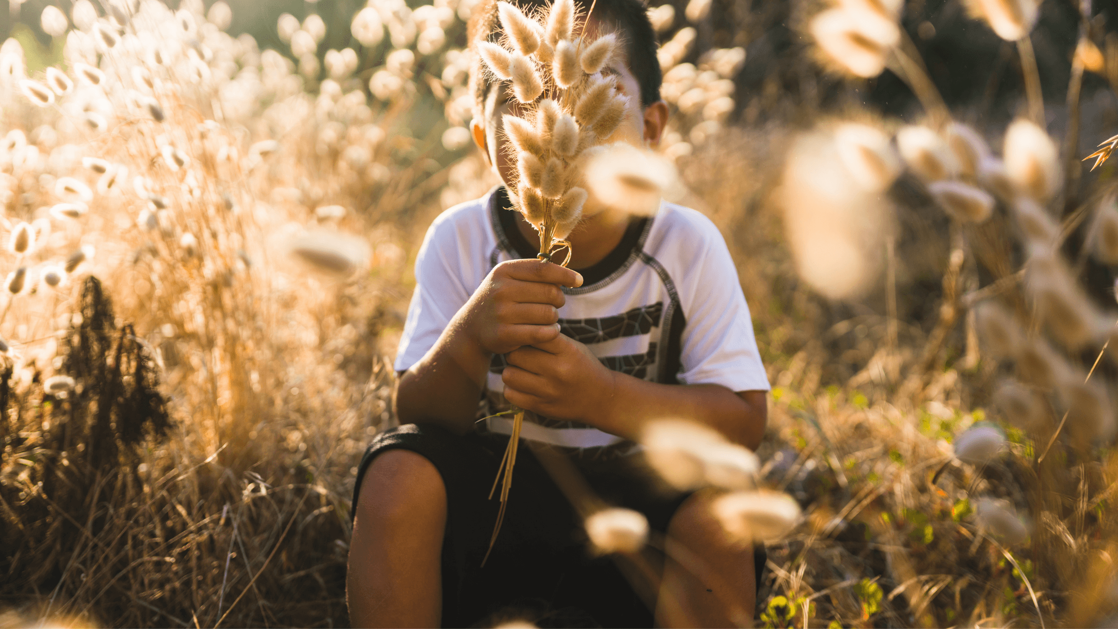Kid sitting in the farm