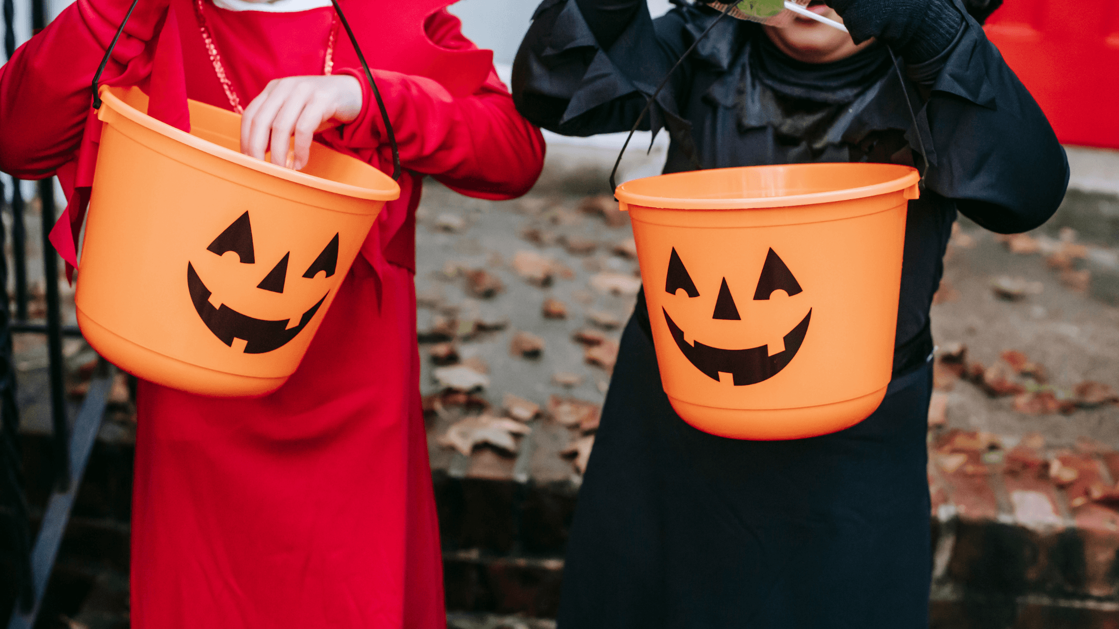 kids Celebrating Halloween having halloween buckets in hand