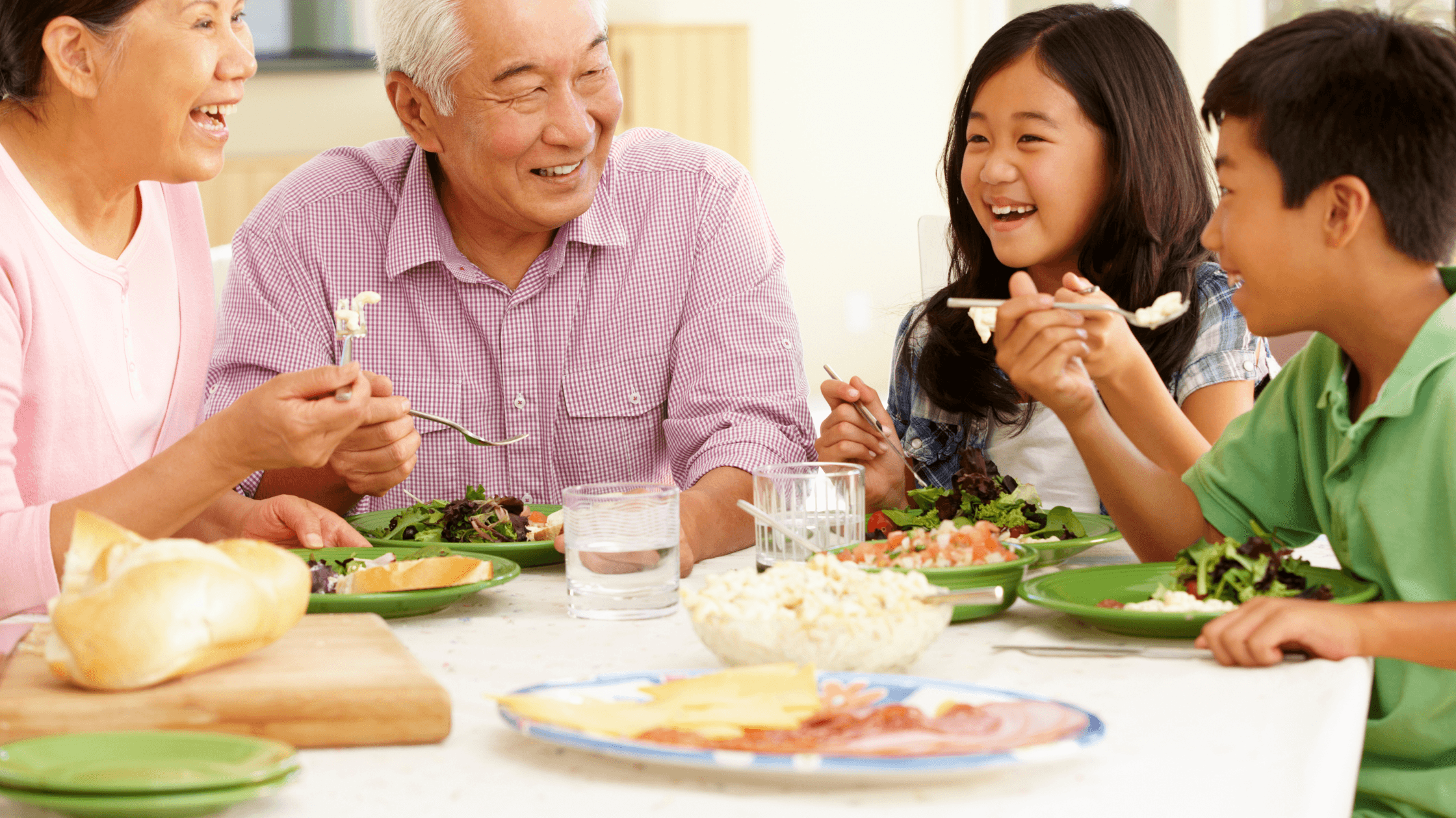 Adults and Kids are having Meal Together