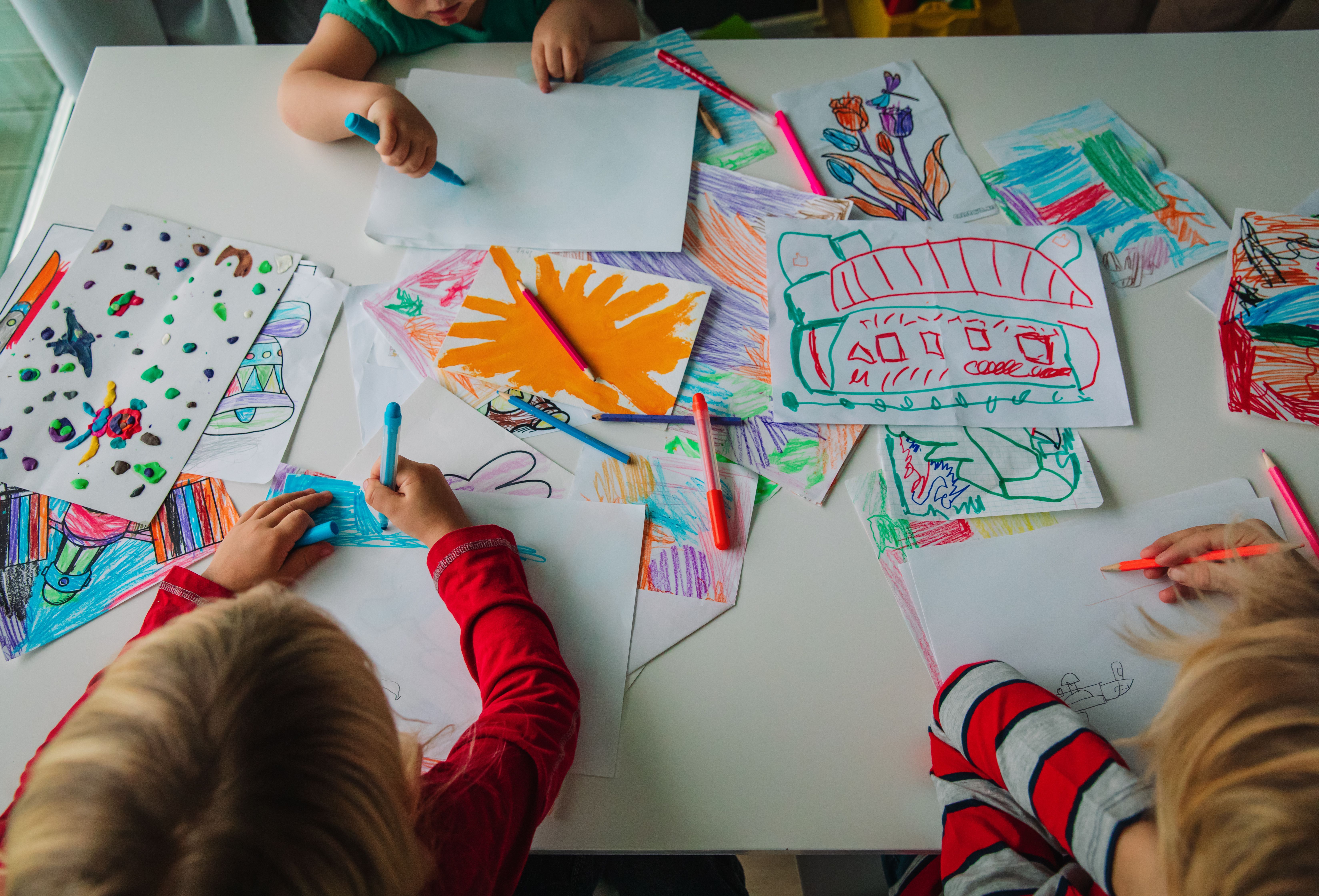 Kids are drawing and painiting with Beautiful colors 
